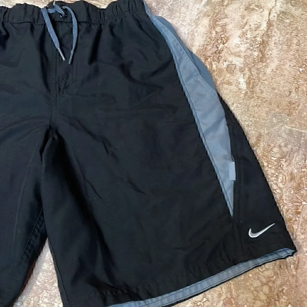 Nike men’s black/gray swim trunks. Size S.
